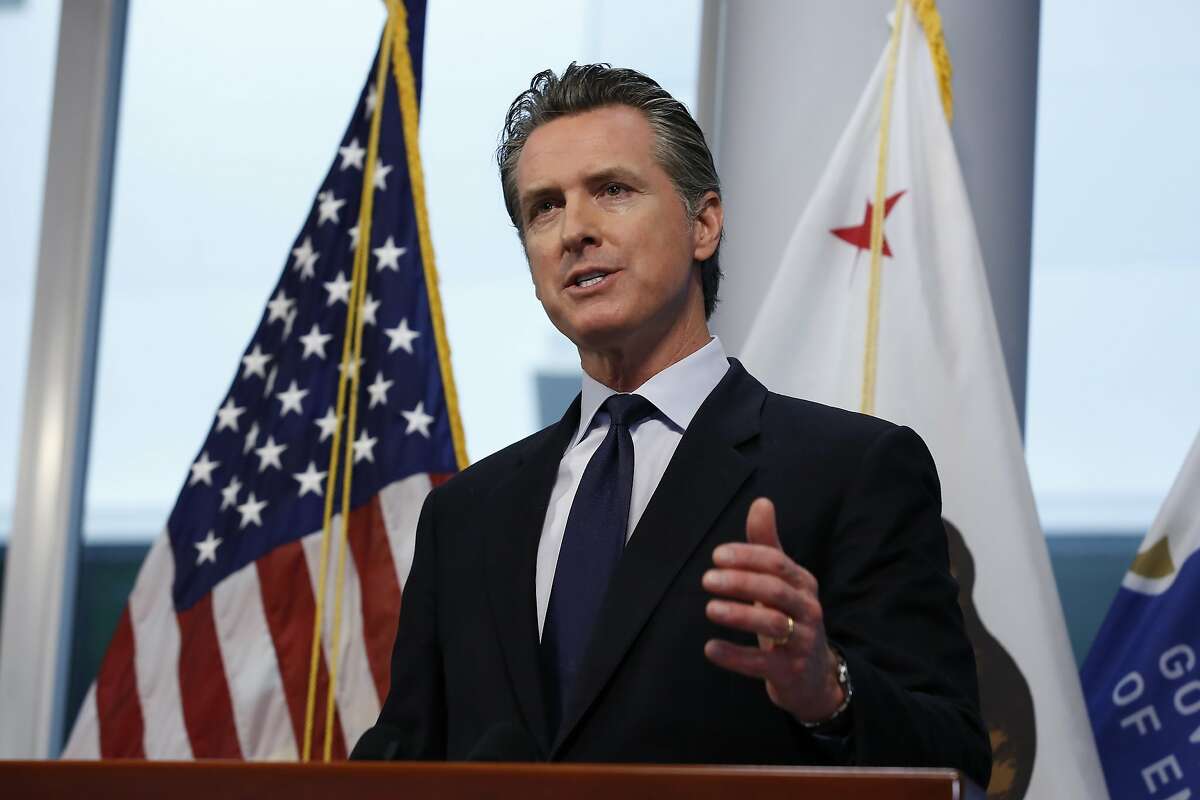 Gov. Gavin Newsom updates the state's response to the coronavirus, at the Governor's Office of Emergency Services in Rancho Cordova, Calif., Monday, March 30, 2020. Newsom announced the state is enlisting retired doctors and medical and nursing students to help treat an anticipated surge of coronavirus patients. (AP Photo/Rich Pedroncelli, Pool)