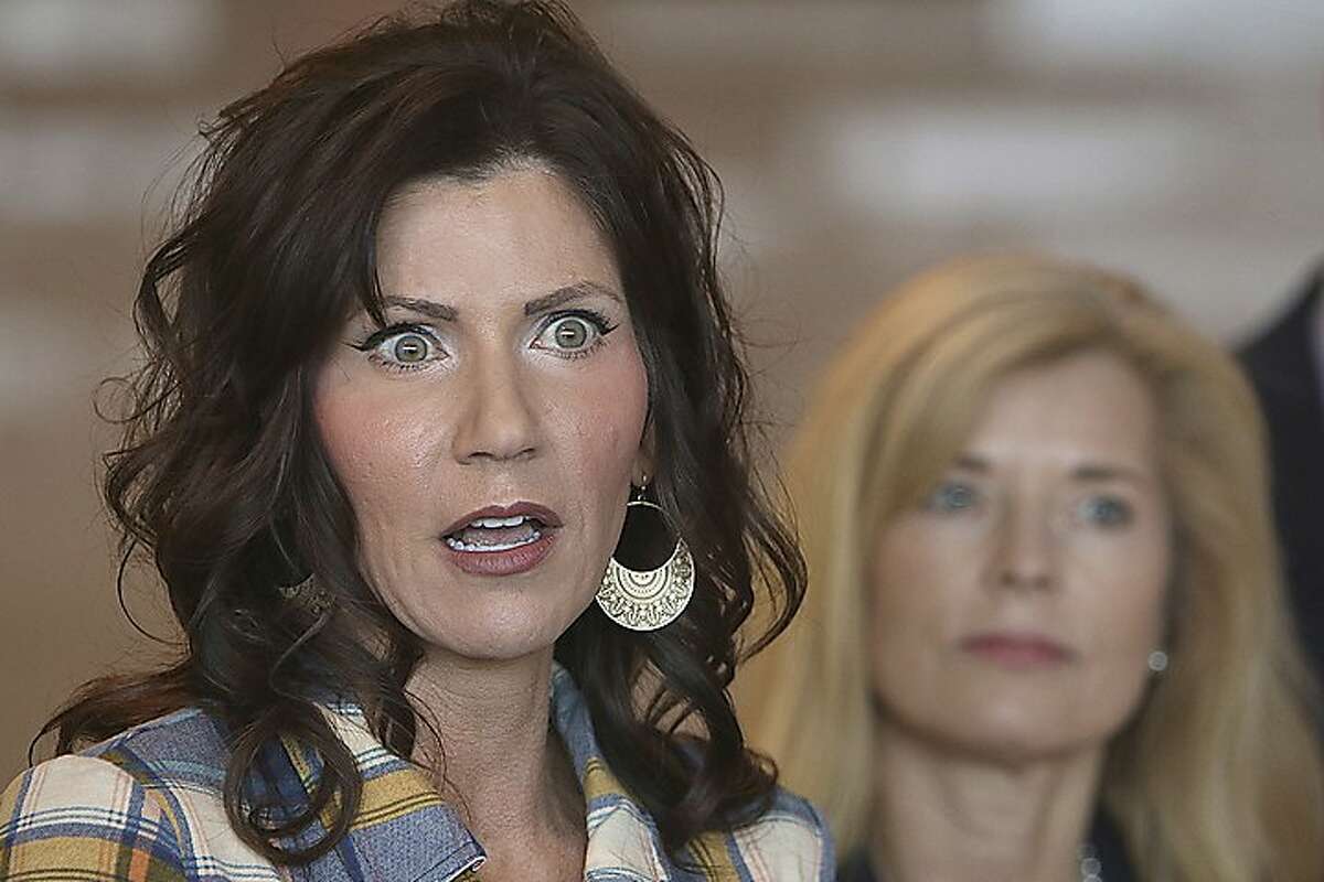 South Dakota Gov. Kristi Noem, left, updates media on the COVID-19 pandemic March 18, 2020, during a press conference at Monument Health in Rapid City, S.D. 