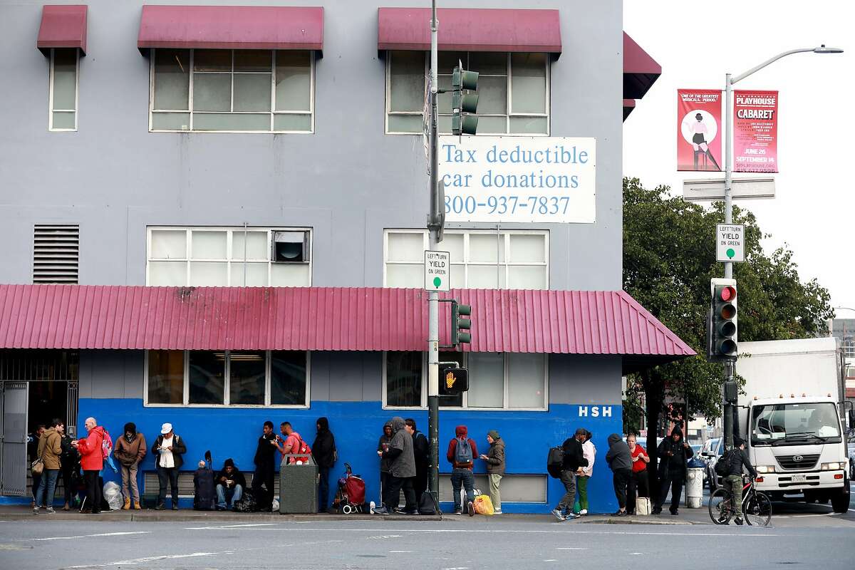 Folks stand in line outside Multi-Service Center South, located at 525 5th St., as they seek shelter for the night in San Francisco, Calif., on Tuesday, June 18, 2019. Shot from the intersection of Fifth and Bryant at 6:45 PM, facing 525 5th St.