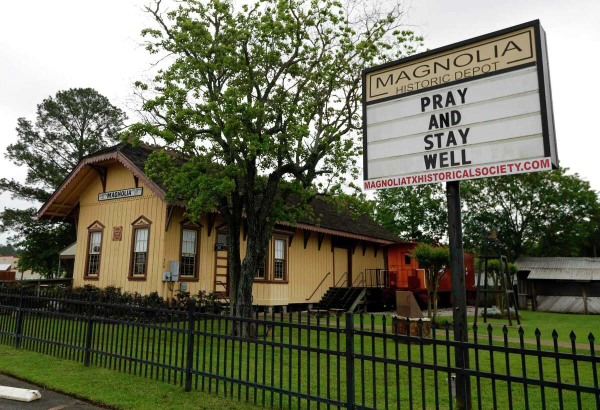 A sign at the Magnolia historic train depot encourages residents to pray and stay well, Tuesday, April 7, 2020, in Magnolia.