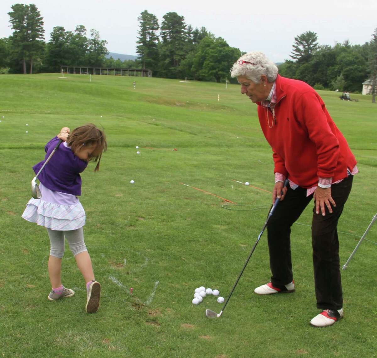 PGA/LPGA Professional Kay McMahon with her young student Maria Glavin, 7, of Waterford. Maria started taking lessons from McMahon when she was 4 years old.