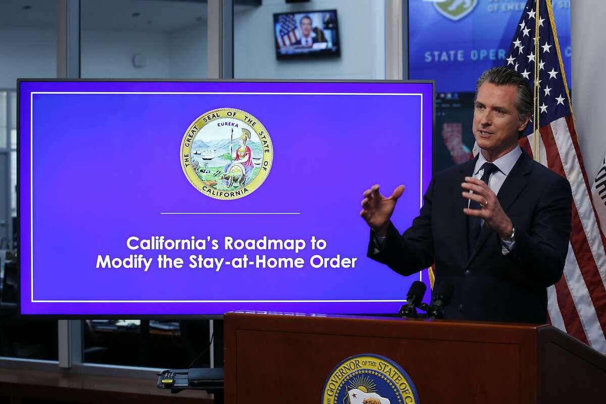 California Gov. Gavin Newsom discusses an outline for what it will take to lift coronavirus restrictions during a news conference at the Governor's Office of Emergency Services in Rancho Cordova, Calif., Tuesday, April 14, 2020. Newsom said he won't loosen the state's mandatory stay-at-home order until hospitalizations, particularly those in intensive care units, "flatten and start to decline."(AP Photo/Rich Pedroncelli, Pool)