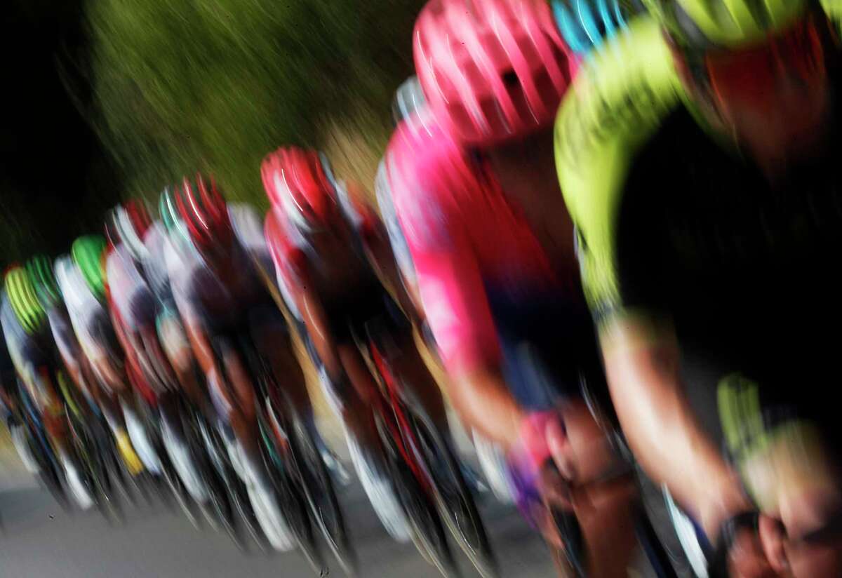 FILE - In this July 24 2019 file photo, riders pedal during the seventeenth stage of the Tour de France cycling race over 200 kilometers (124,27 miles) with start in Pont Du Gard and finish in Gap, France. The Tour de France won't begin at its originally planned date after French President Emmanuel Macron canceled all public events gathering large crowds through mid-July because of the novel coronavirus epidemics. Tour organizers said on Tuesday it's now impossible that the three-week race starts on June 27 from the Riviera city of Nice as originally planned. (AP Photo/Thibault Camus, file)