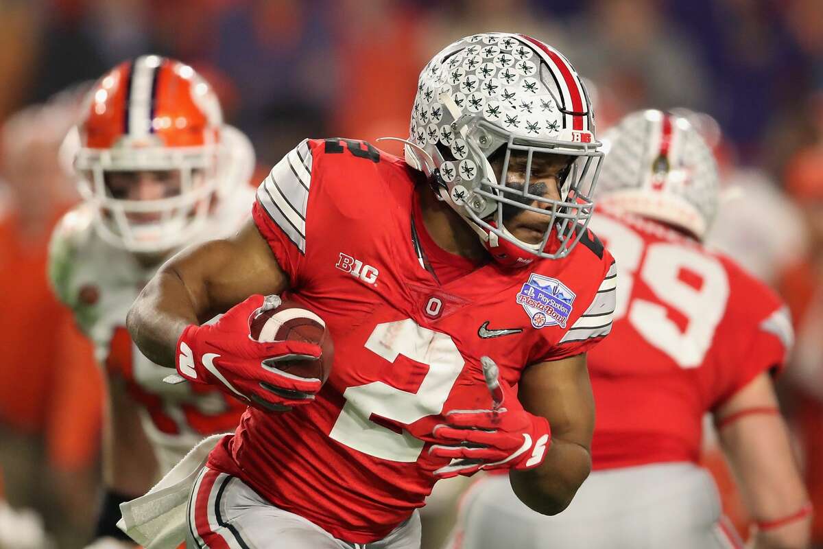 GLENDALE, ARIZONA - DECEMBER 28: Running back J.K. Dobbins #2 of the Ohio State Buckeyes rushes the football against the Clemson Tigers during the PlayStation Fiesta Bowl at State Farm Stadium on December 28, 2019 in Glendale, Arizona. The Tigers defeated the Buckeyes 29-23. (Photo by Christian Petersen/Getty Images)
