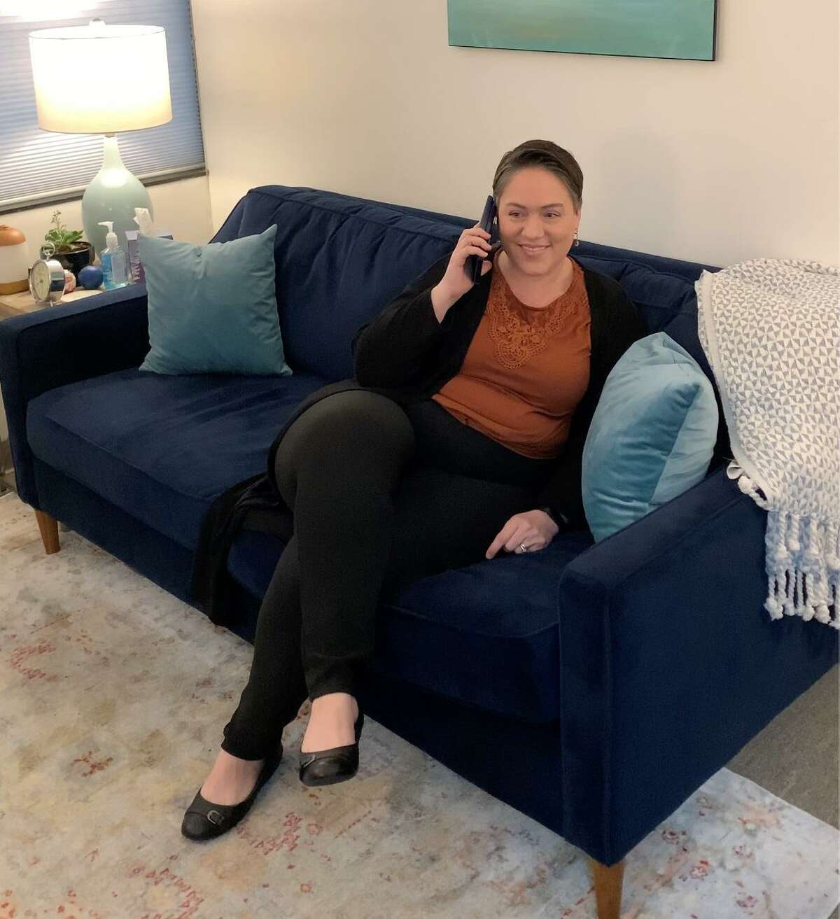 A therapist at Eddins Counseling Group in Houston sits down for a phone session with a client. All of the group’s services have gone to online sessions or teletherapy because of the COVID-19 pandemic and social distancing, and it is changing therapy for clients with autism.