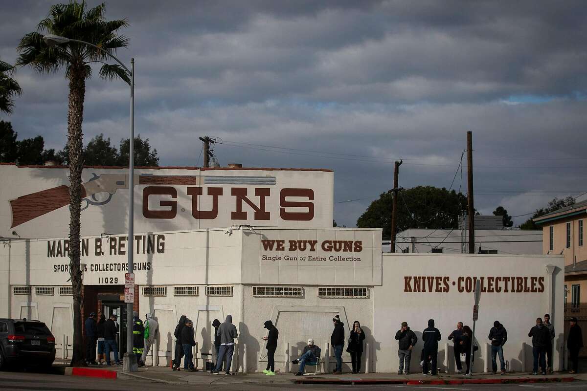 A line at the Martin B. Retting gun store in Culver City, Calif., on Sunday, March 15, 2020 extends out the door and around the corner. (Francine Orr/ Los Angeles Times/TNS)