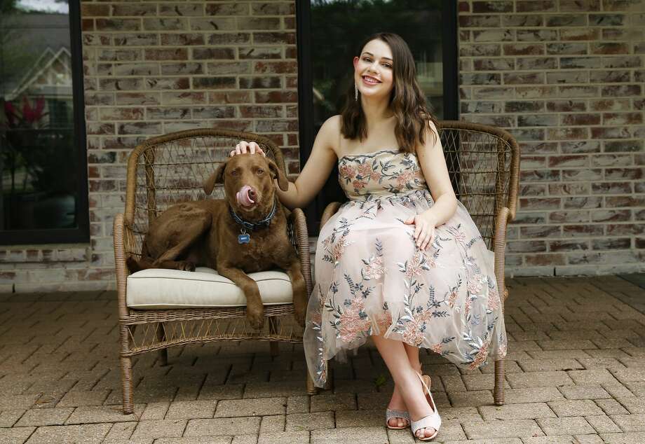 Ellie DiPaolo, one of this year's valedictorians at Stratford High School, designed her prom dress. These days, she's making masks for friends and health care workers. Photo: Elizabeth Conley/Staff Photographer / ? 2020 Houston Chronicle