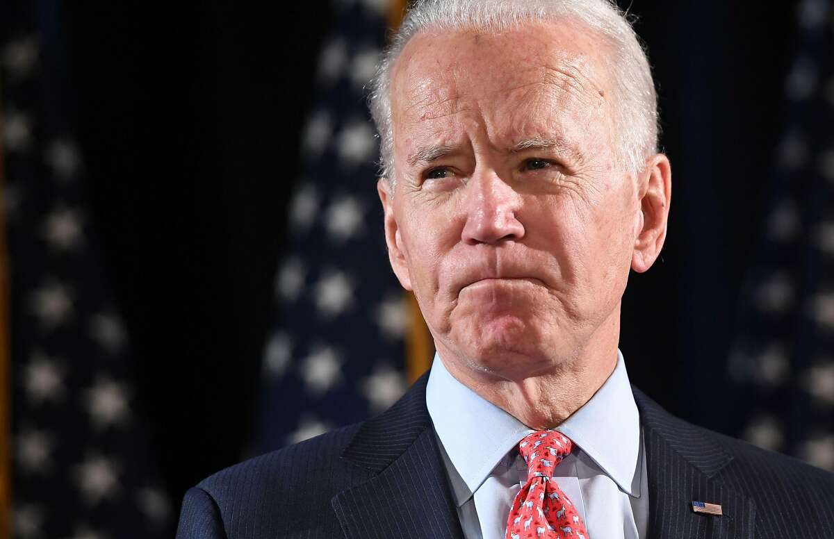 (FILES) In this file photo taken on March 12, 2020 former US Vice President and Democratic presidential hopeful Joe Biden speaks about COVID-19, known as the Coronavirus, during a press event in Wilmington, Delaware. - Barack Obama celebrated the kickoff of his "historic" White House challenge before thousands of ecstatic supporters. Hillary Clinton also marked her "milestone," as the first woman nominee of a major US party, to thunderous applause. And what of Joe Biden? The resurgent Democrat has been denied the climactic rollout that his predecessors enjoyed. (Photo by SAUL LOEB / AFP) (Photo by SAUL LOEB/AFP via Getty Images)