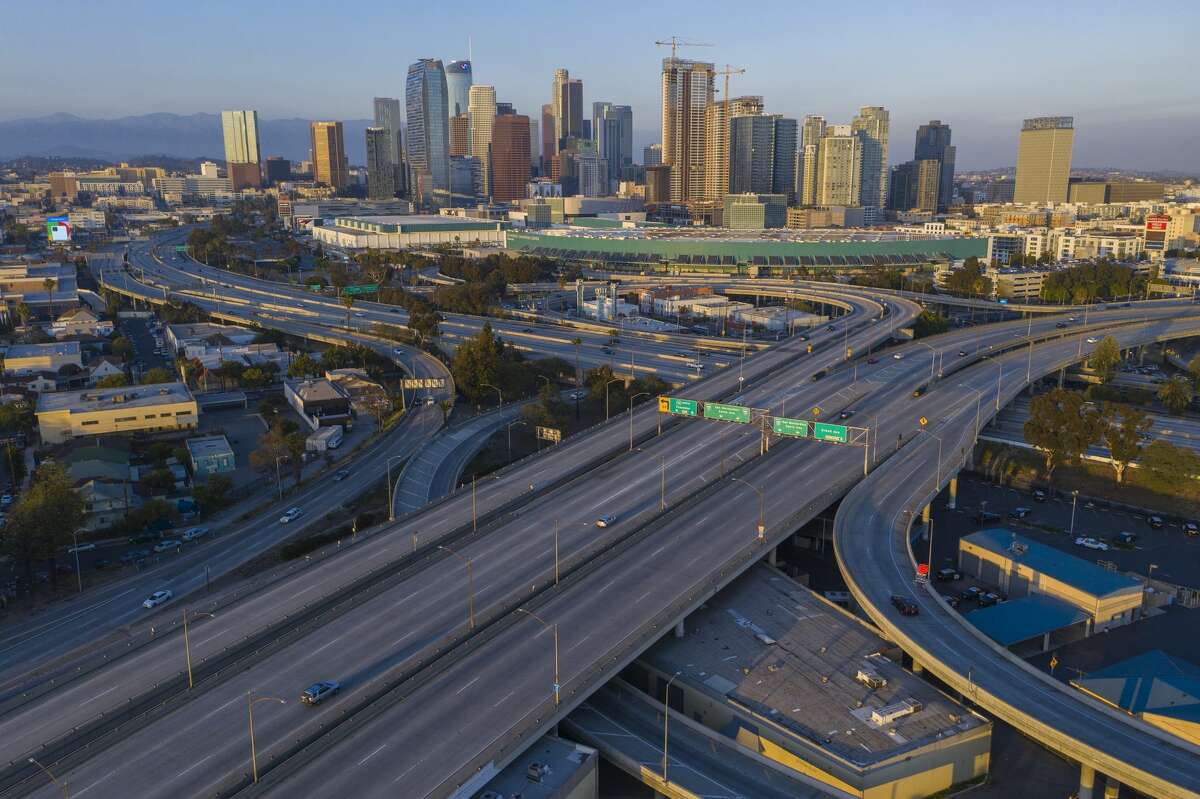 FILE: Extremely light traffic for the region is seen in an aerial view of the 10 and 110 freeway interchange on April 1, 2020 in Los Angeles.