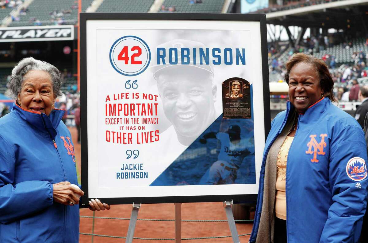 Forced from the field by the new coronavirus, Major League Baseball moved its annual celebration of Jackie Robinson online Wednesday on the 73rd anniversary of his April 15, 1947 debut with the Dodgers. His widow Rachel Robinson (left) and daughter Sharon posed for a photograph with a plaque honoring Jackie on Jackie Robinson Day in 2018 before a Mets-Brewers game in New York.