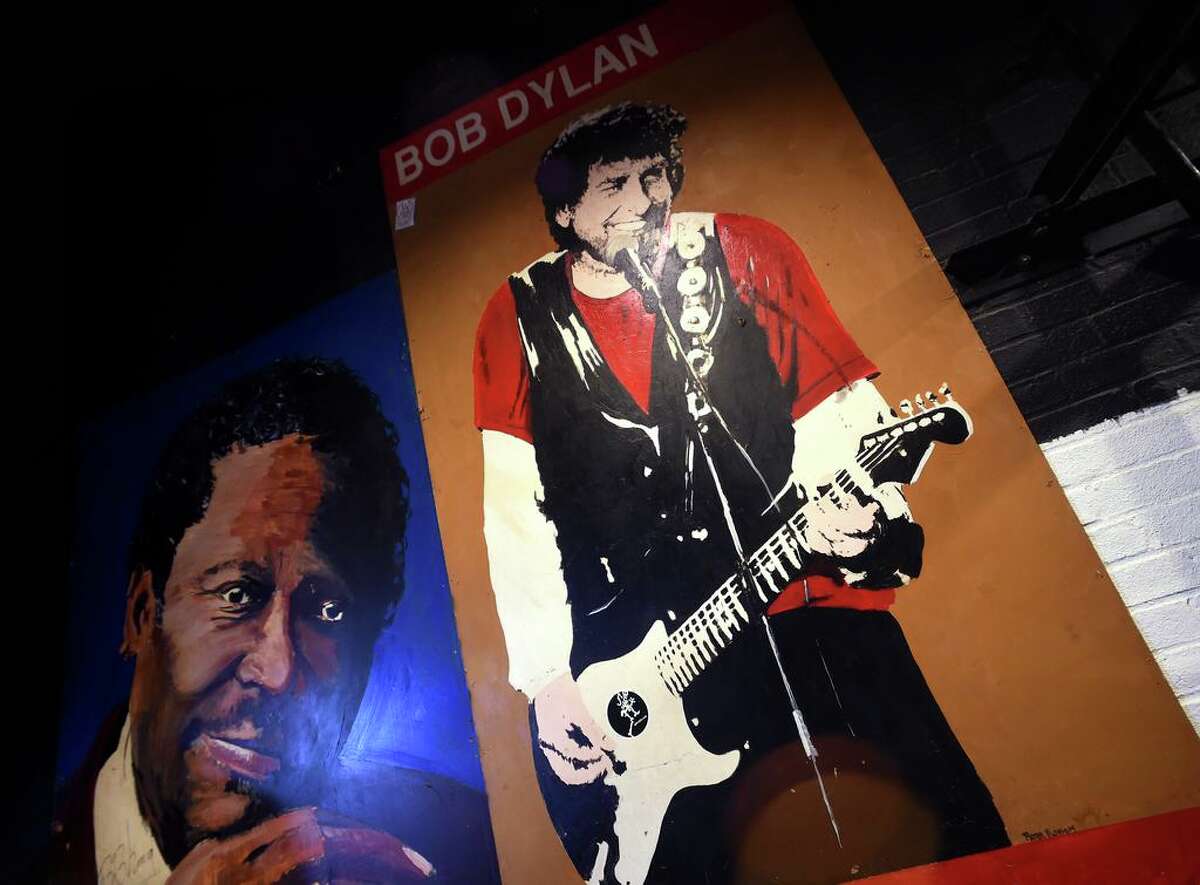 A painting inspired by a photograph of Bob Dylan by former New Haven Register photographer Peter Tobia taken on January 12, 1990 hangs at Toad's Place in New Haven on February 1, 2018.