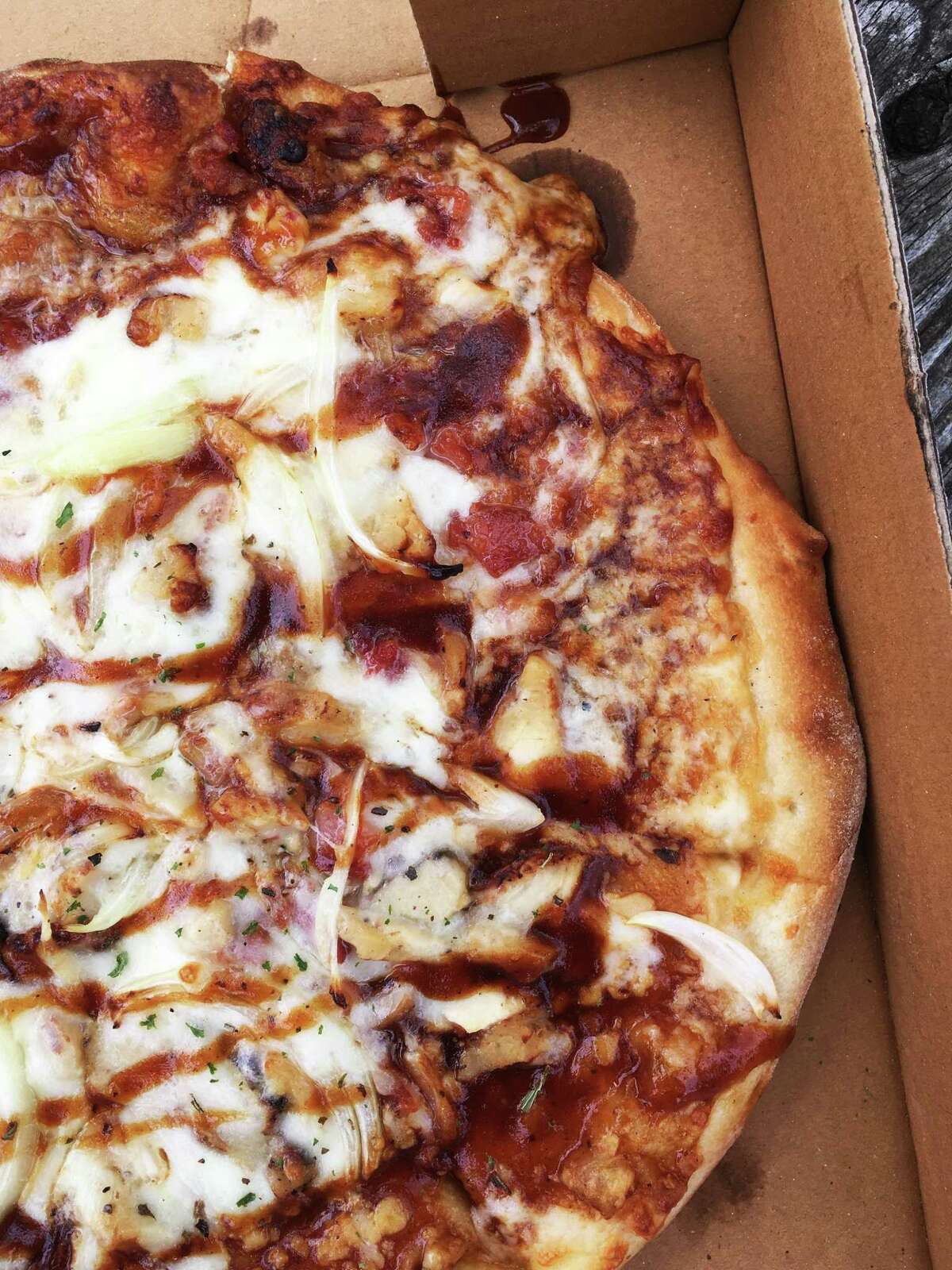 The barbecue chicken pizza at Rami's is loaded with a mixture of sweet barbecue sauce, white meat chicken, onions and bacon.