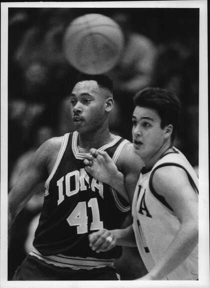 Iona's #41 Harry Hart and Siena's #50 Matt Gras defend each other as the ball passes above their heads during Saturday nights game at Siena College, New York. February 13, 1993. Gras died from COVID-19 in 2020.