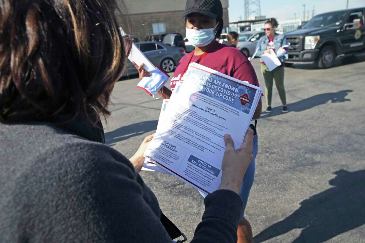 Flyers warning of contagion dangers are readied as Metro Health’s Community Health and Prevention team sets out to deliver COVID-19 information to local businesses this week.