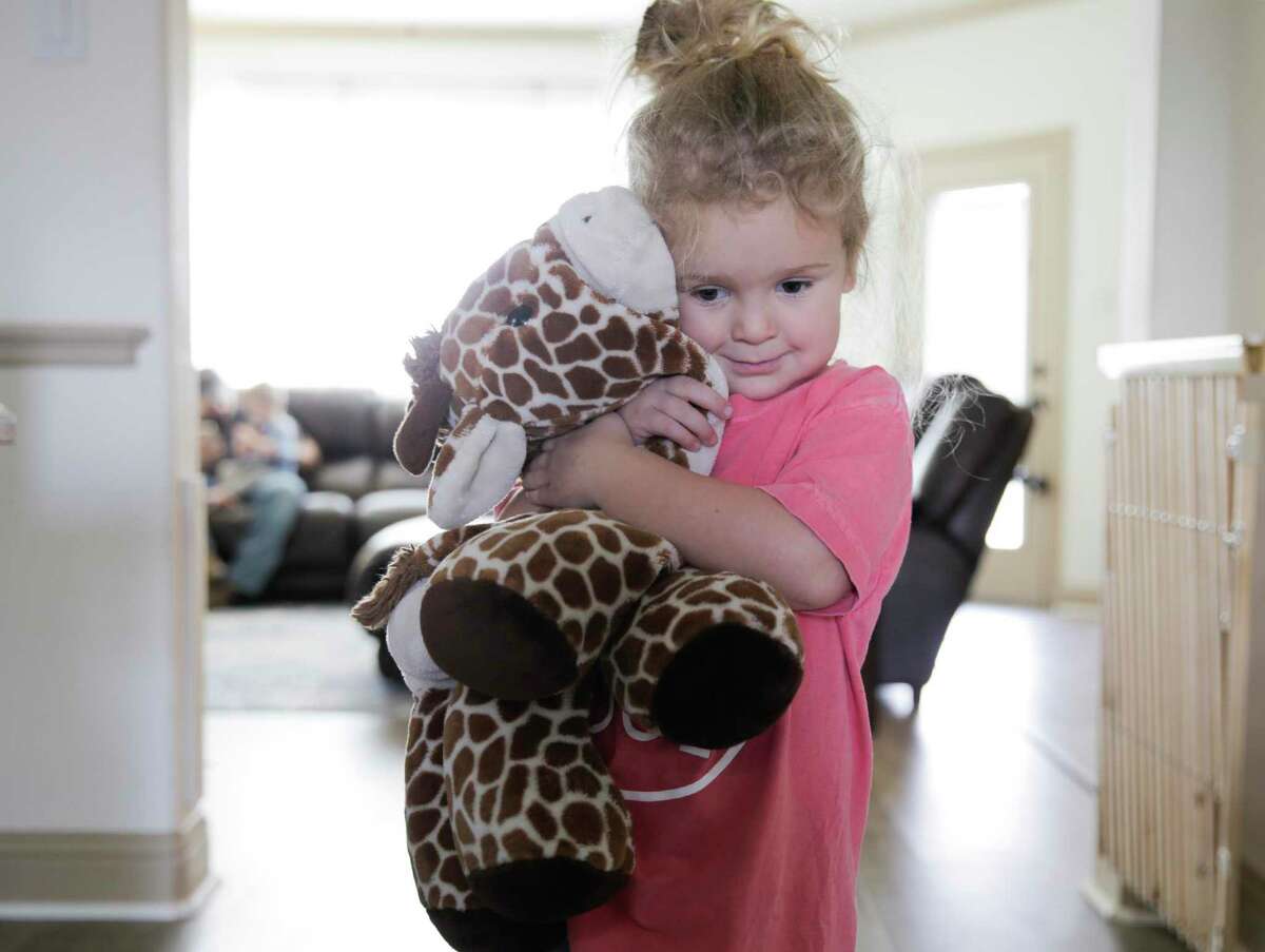 A child hugs a stuffy she received years ago on a trip to the zoo with her mom. With children staying at home now, and families facing increased stress, the potential for child abuse is high. There are still many ways to support families and report potential abuse.