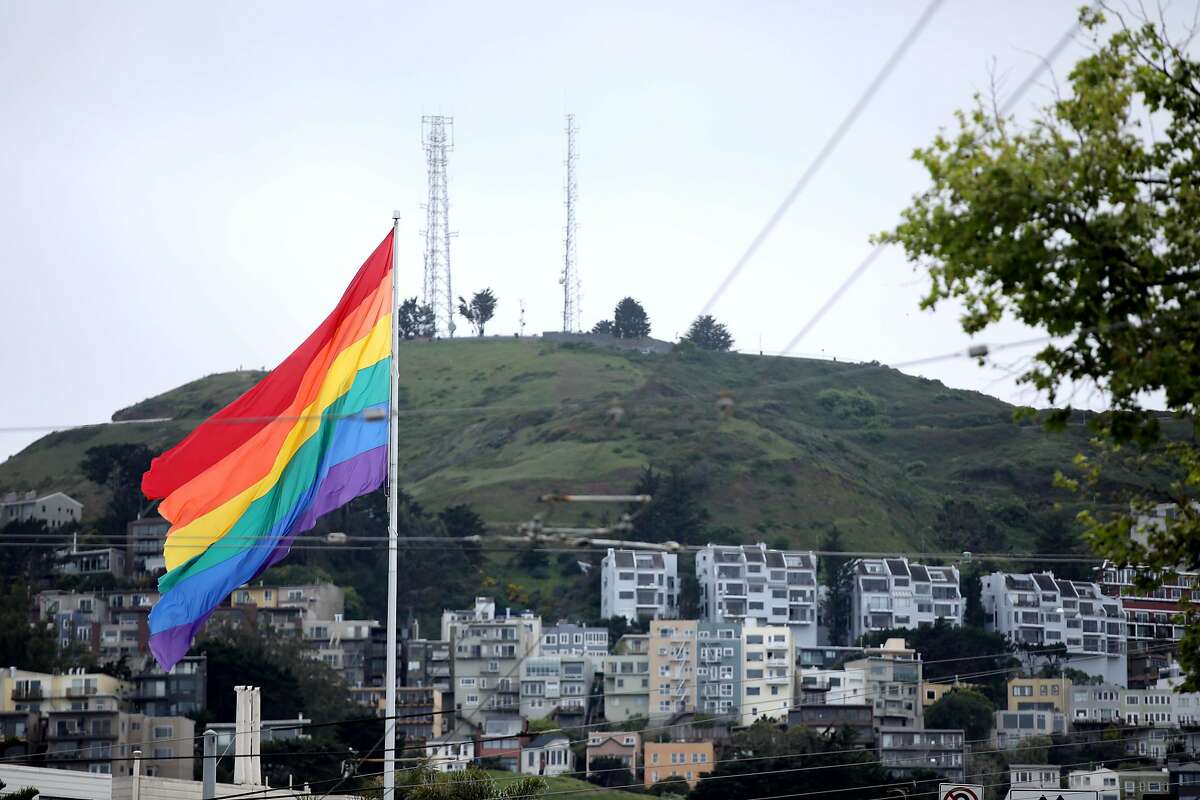 A massive rainbow flags hangs on a flagpole in The Castro on Saturday, April 11, 2020, in San Francisco, Calif.