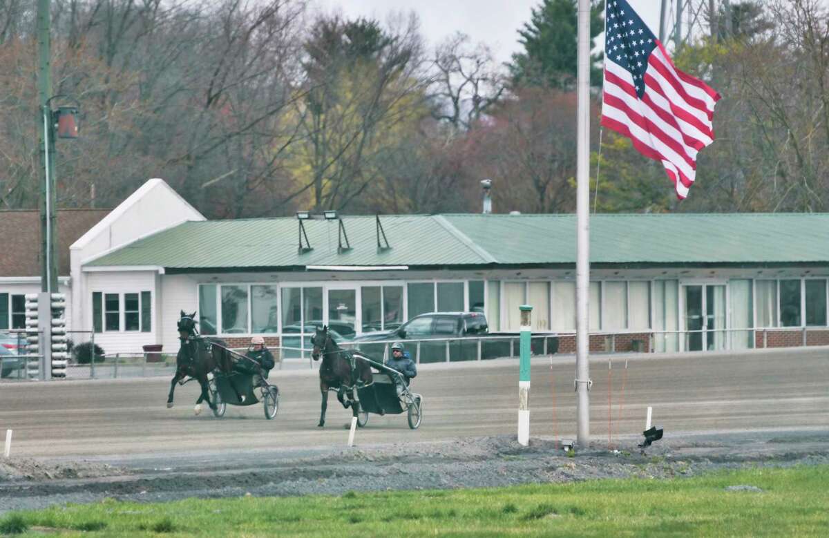 Drivers run horses around the track during a workout at the Saratoga Harness Track on Thursday, April 16, 2020, in Saratoga Springs, N.Y. (Paul Buckowski/Times Union)