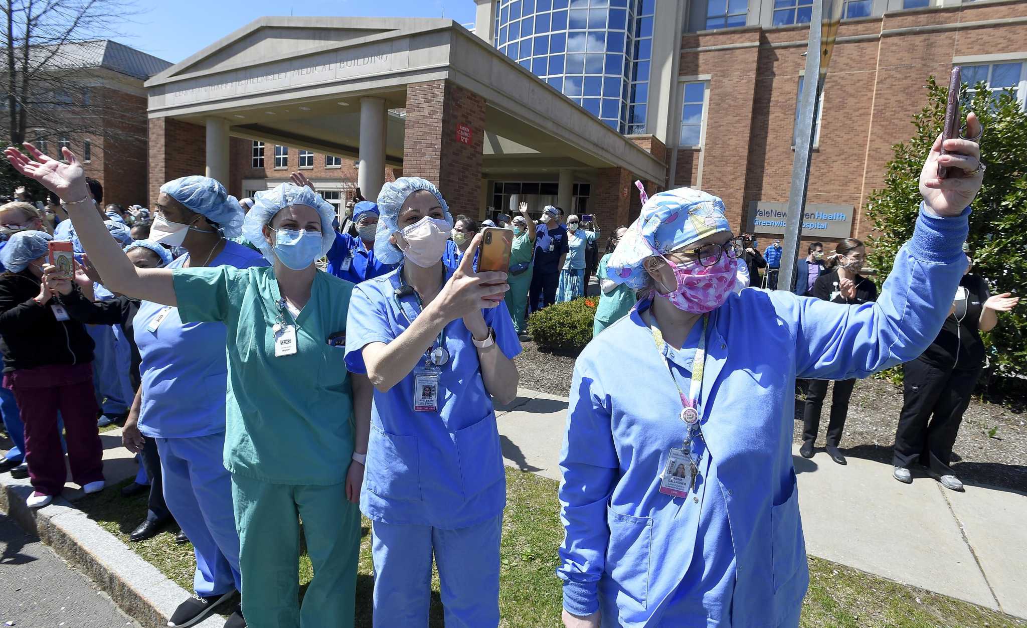 You're our hero! Neighbors surprise Darien nurse with messages of