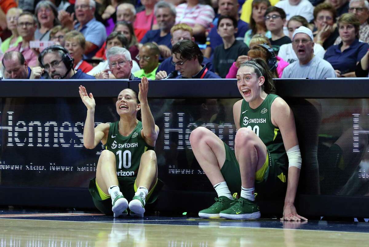 UNCASVILLE, CT - JULY 20: Seattle Storm guard Sue Bird (10) and Seattle Storm forward Breanna Stewart (30) cheer on their team as they wait to enter the game during a WNBA game between Seattle Storm and Connecticut Sun on July 20, 2018, at Mohegan Sun Arena in Uncasville, CT. Seattle defeated Connecticut 78-65. (Photo by M. Anthony Nesmith/Icon Sportswire via Getty Images)
