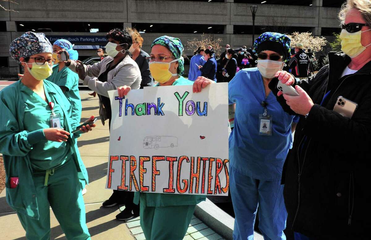 Bridgeport Hostpital health care workers were honored by dozens of first responders who arrived in a parade to thank them for their hard work fighting the coronavirus pandemic in Bridgeport, Conn., on Thursday Apr. 16, 2020.