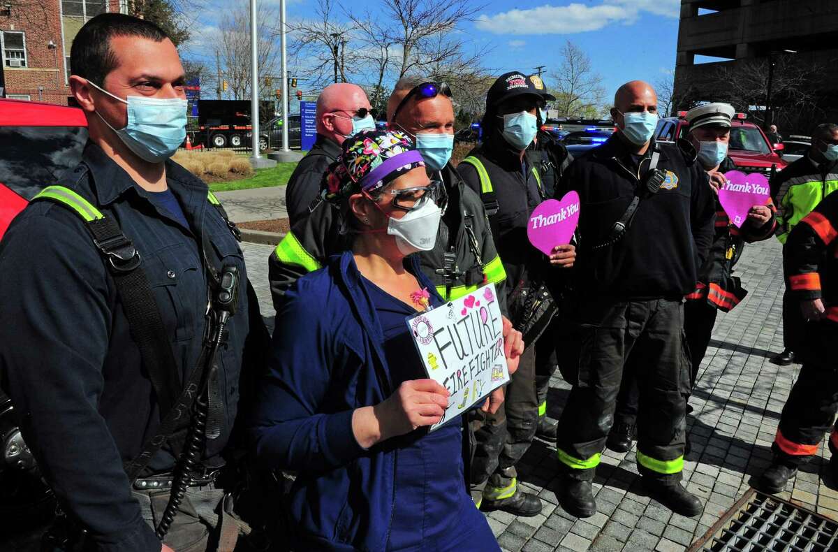 Bridgeport Hostpital health care workers were honored by dozens of first responders who arrived in a parade to thank them for their hard work fighting the coronavirus pandemic in Bridgeport, Conn., on Thursday Apr. 16, 2020.