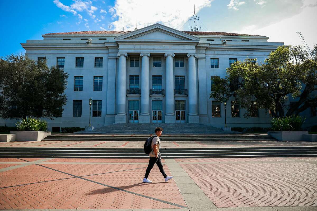 A man walks past Sproul Hall on the UC Berkeley campus a day after Berkeley suspended in-person classes through the end of Spring break due to the coronavirus on Tuesday, March 10, 2020 in Berkeley, California.