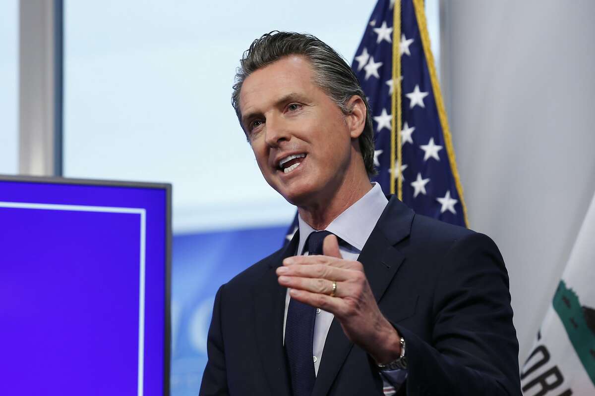 FILE - In this file photo taken Tuesday April 14, 2020, California Gov. Gavin Newsom discusses an outline for what it will take to lift coronavirus restrictions during a news conference at the Governor's Office of Emergency Services in Rancho Cordova, Calif. Newsom announced Wednesday, April 15, 2020, that he would spend $75 million of taxpayer money to create a Disaster Relief Fund for immigrants living in the country illegally. (AP Photo/Rich Pedroncelli,File)