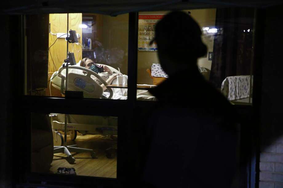 After arriving at Uvalde Memorial Hospital around 3:20 a.m. on April 13, Alex Benavidez spent the morning watching Kayla labor through the hospital room window. They talked often by phone and video calls. Photo: Jerry Lara / **MANDATORY CREDIT FOR PHOTOG AND SAN ANTONIO EXPRESS-NEWS/NO SALES/MAGS OUT/TV   © 2019 San Antonio Express-News