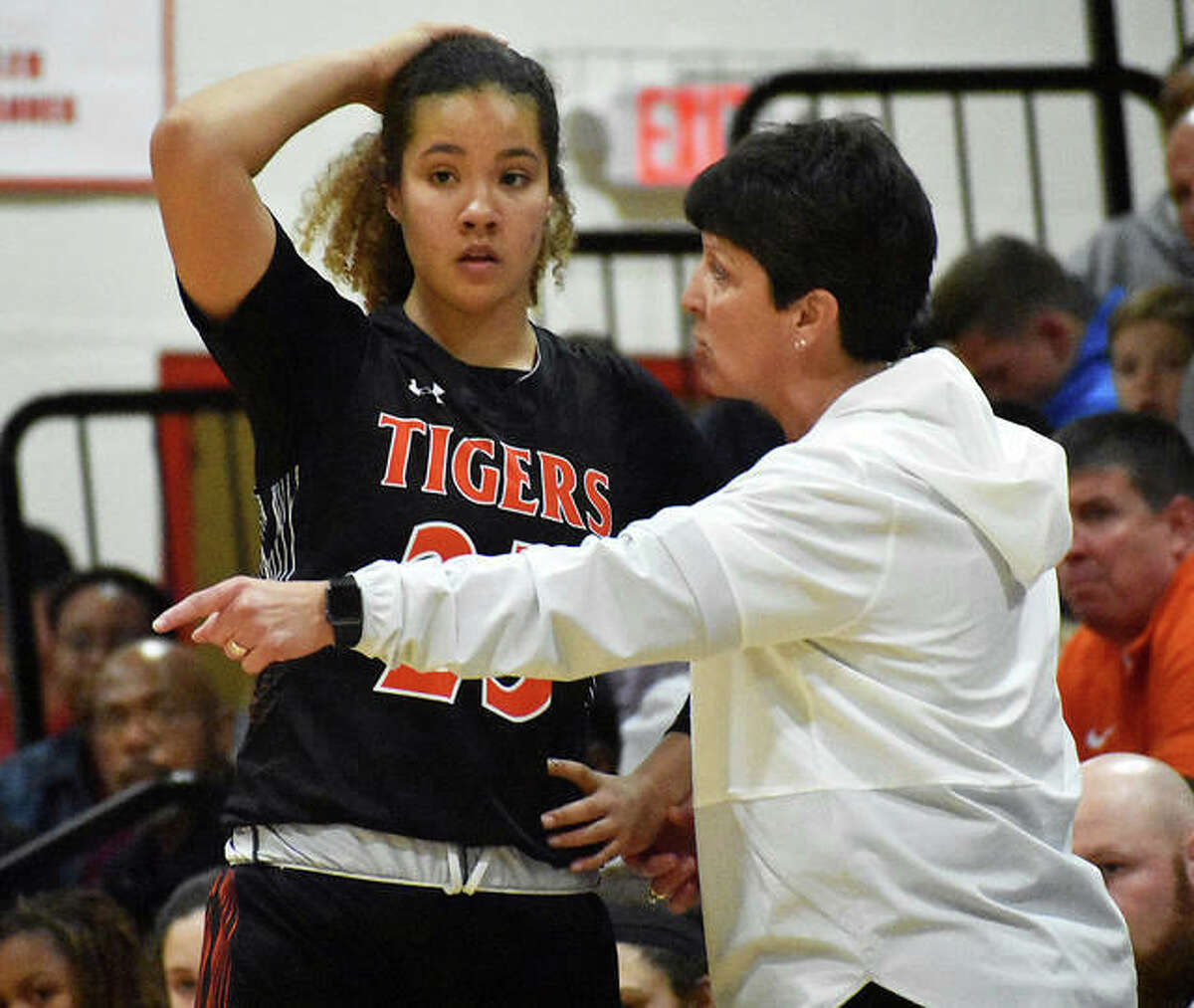 Edwardsville girls basketball coach Lori Blade talks to Sydney Harris during a game at the Visitation Christmas Tournament in December in St. Louis.