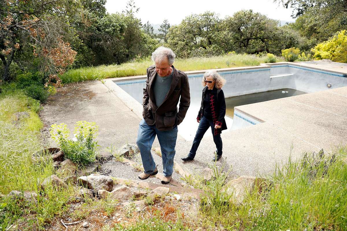 Howard Klepper and Helen Sedwick visit the former site of their home that was destroyed in the 2017 Nuns Fire. Photographed in Santa Rosa, Calif., on Thursday, April 16, 2020.