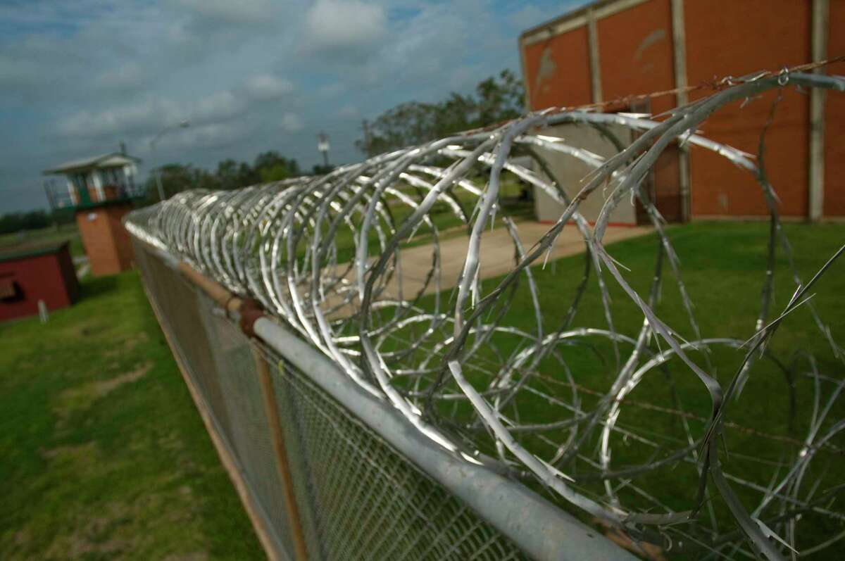 Texas Department of Criminal Justice inmate Marlow Wayne Reynolds climbed a razor wire topped fence, about at this location, at the Stringfellow Unit near Rosharon, seen Wednesday morning, and ran westward early in the evening of September 9. Tracking dogs lost the scent of the convicted murderer about 3 miles away at the Brazos River. Reynolds hasn't been seen or heard of since. Wednesday, Sept. 24, 2008, in Rosharon. ( Steve Ueckert / Chronicle )