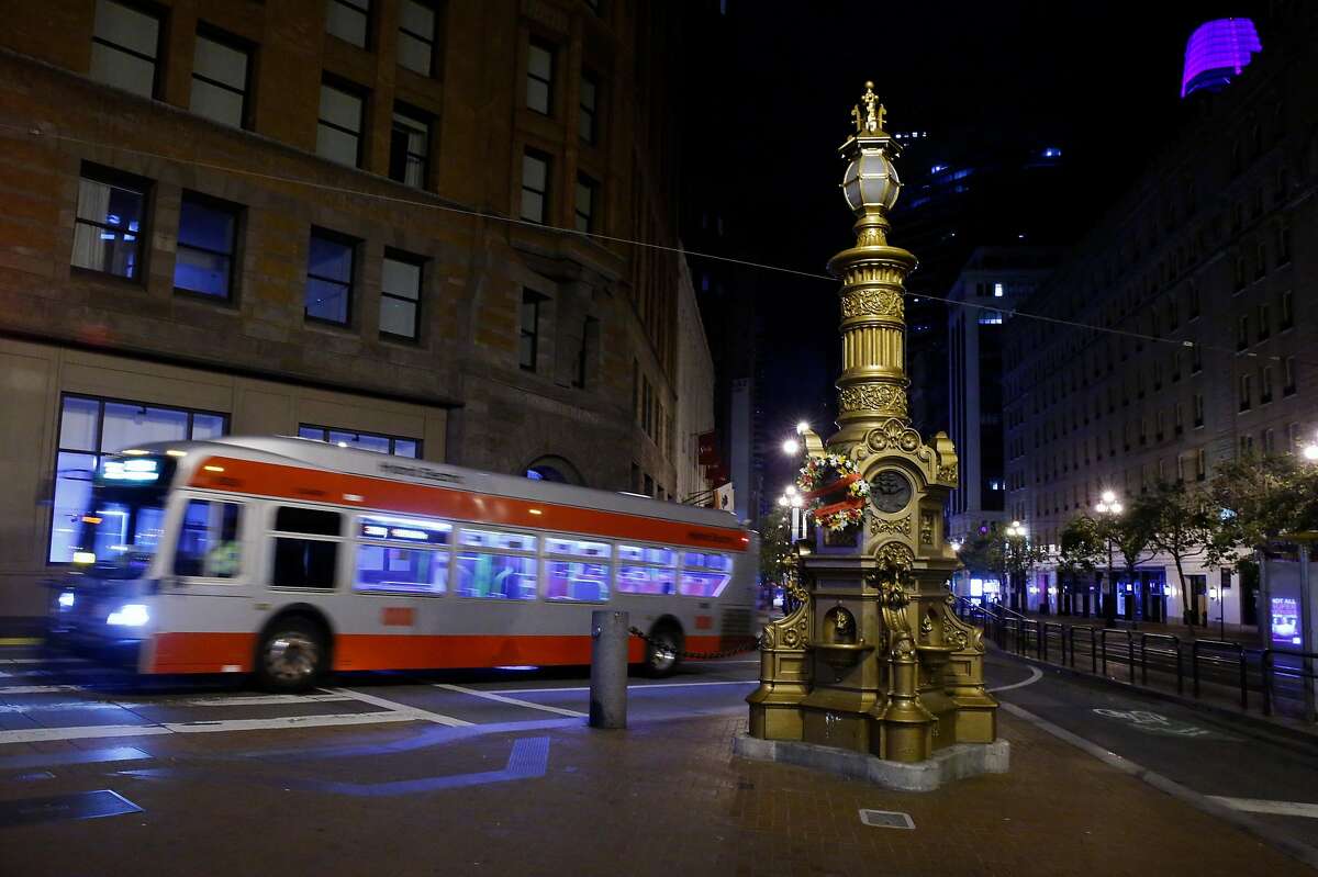 A 38-Geary bus rolls past Lotta’s Fountain on the 114th anniversary of the 1906 earthquake in San Francisco on April 18, 2020.