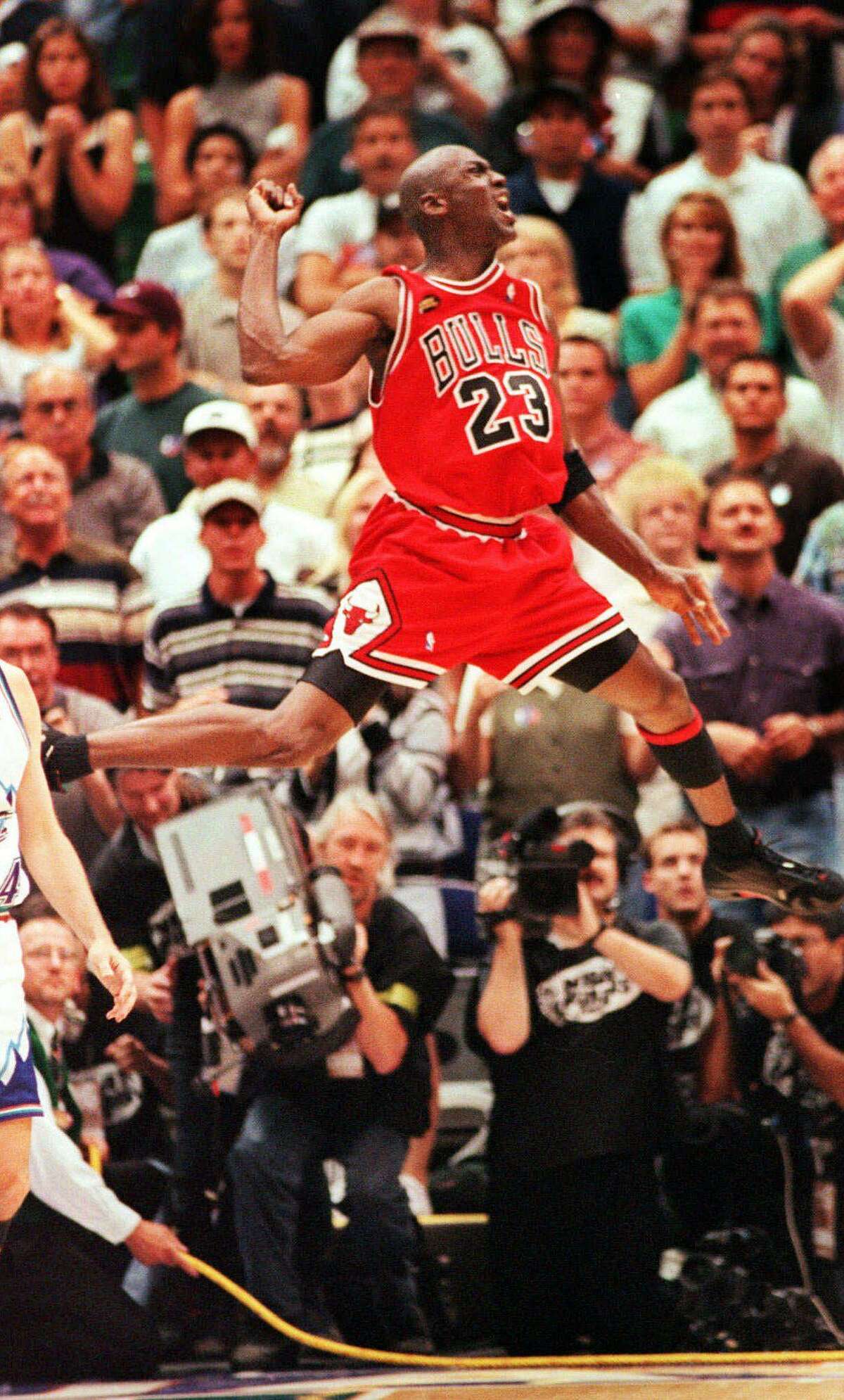 Chicago Bulls' and series MVP Michael Jordan celebrates the Bulls 87-86 defeat over the Utah Jazz in Game 6 of the NBA Finals in Salt Lake City, Sunday, June 14, 1998. The Bulls won their third straight NBA title.