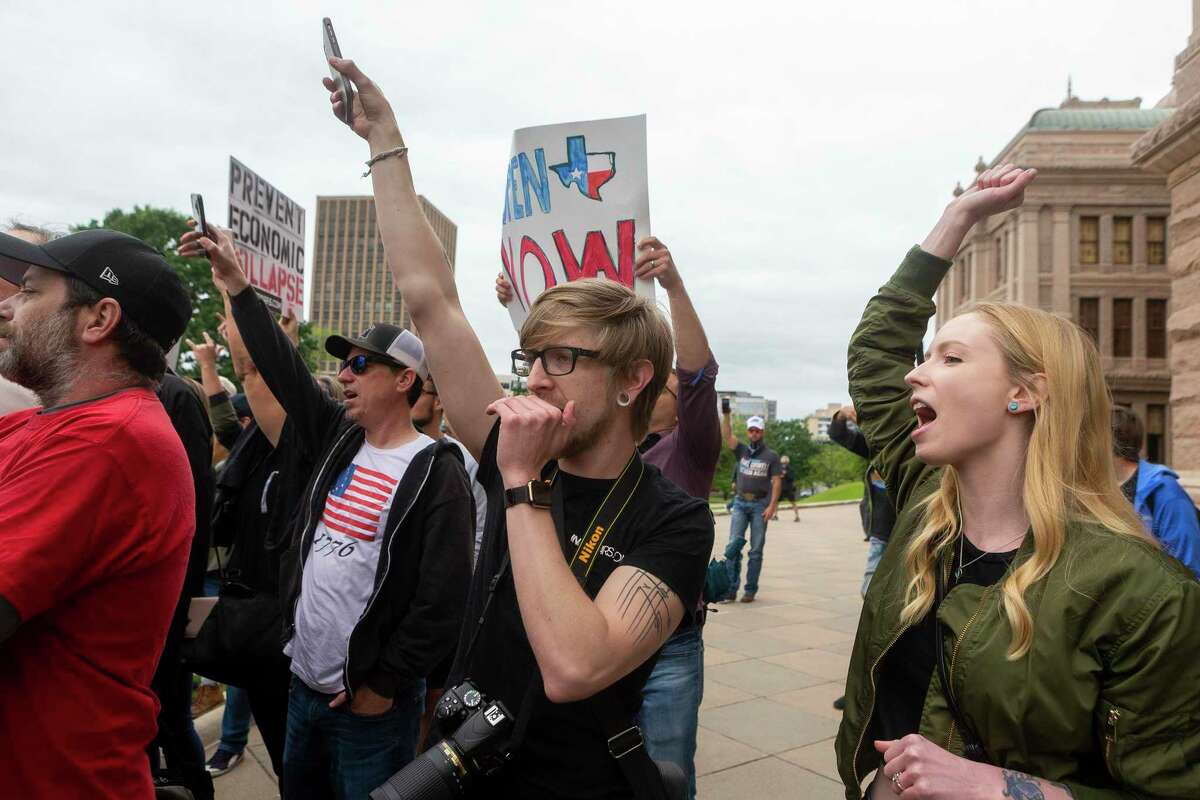 Protestors gather at the Texas Capitol in Austin looking to end to the coronavirus shutdowns, Saturday, April 19, 2020.(Stephen Spillman / for Express-News)