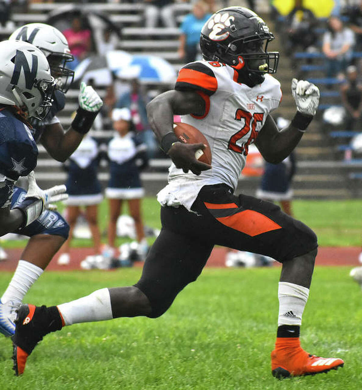 Edwardsville running back Justin Johnson Jr. breaks away from the McCluer North defense for a touchdown in the first quarter of last season’s opener.