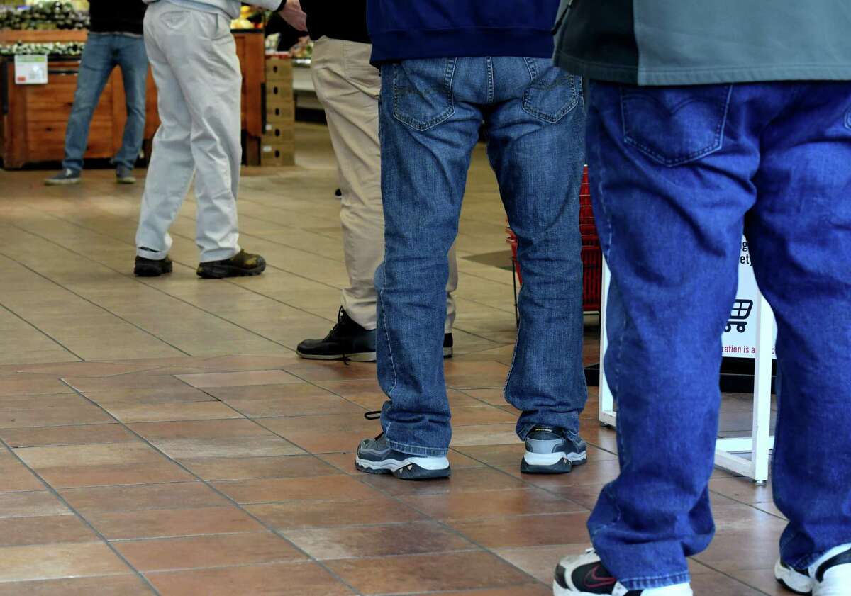 People wait in line to be tested for COVID-19 antibodies by the New York State Department of Health on Monday, April 20, 2020, at a supermarket on Central Avenue in Albany, N.Y. (Will Waldron/Times Union)