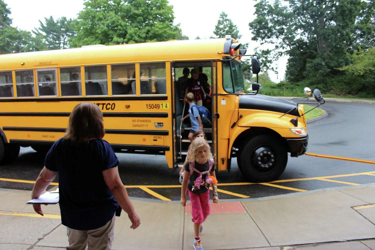 South Elementary School students get off the bus in New Canaan on the first day of school in 2016.