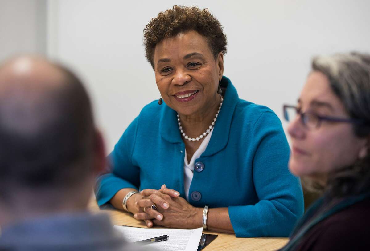 Congresswoman Barbara Lee sits down with federal employees who have been affected by the government shutdown at Red Bay Coffee in Oakland, Calif. Saturday, Jan. 12, 2019.