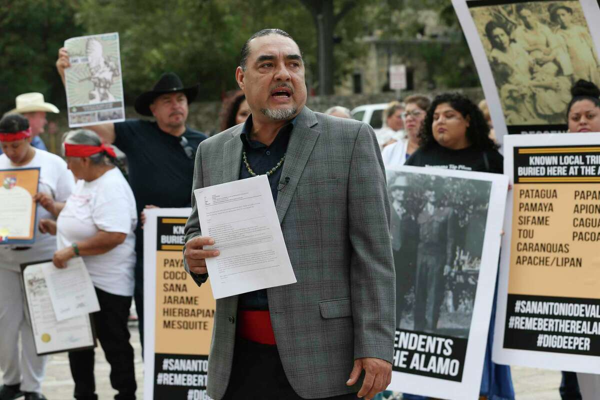 Ramon Vasquez, executive director of American Indians in Texas at the Spanish Colonial Missions, addresses the media during a press conference by the U.S. Postal Service building across the Alamo, Monday, Oct. 14, 2019. The group was expressing concerns over the remains found at the Alamo.