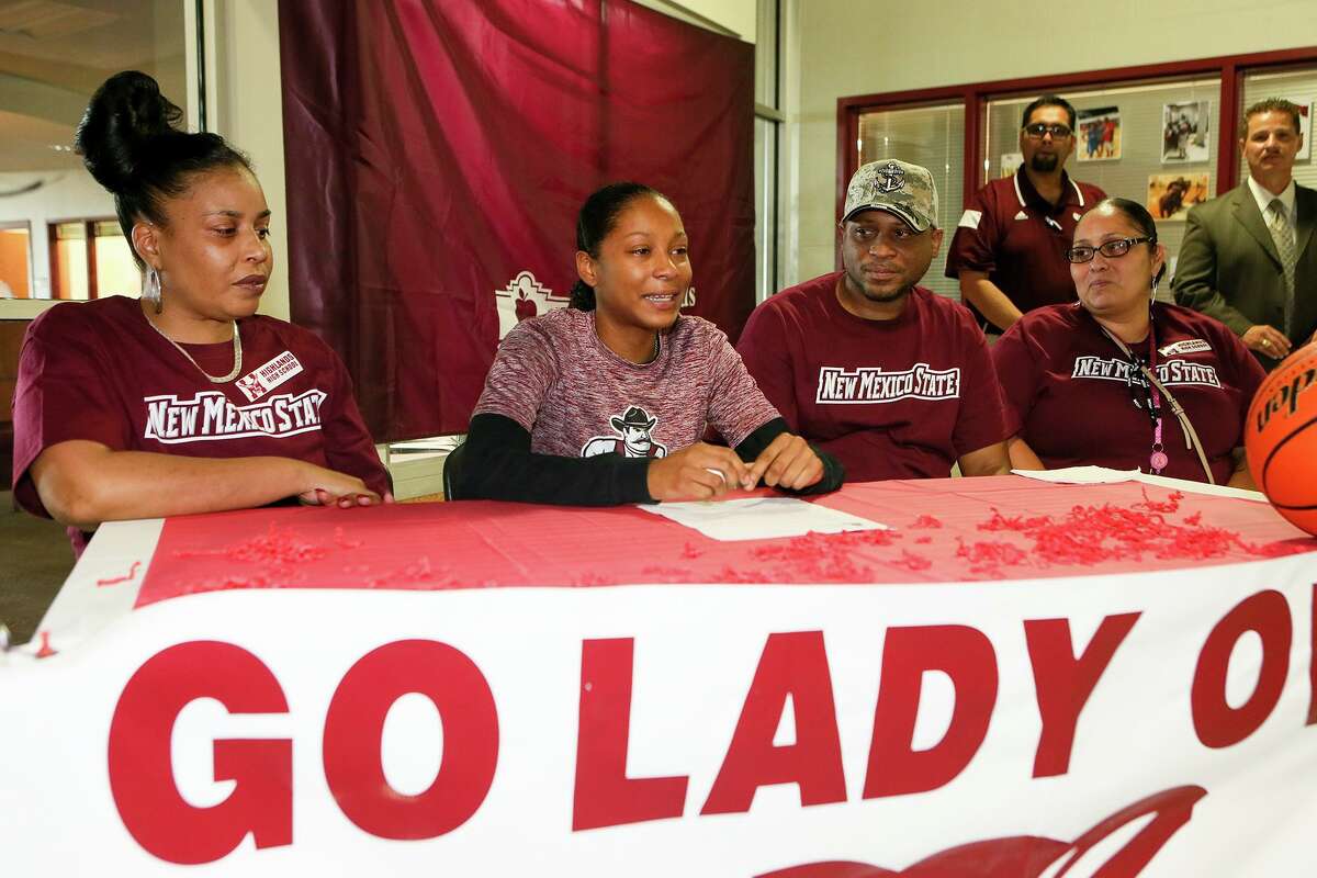 Highland’s Aaliyah Prince (second from left) in 2015 addresses the assembly before signing a letter of commitment to attend New Mexico State Universtiy on a basketball scholarship. Seated next to her are family members.