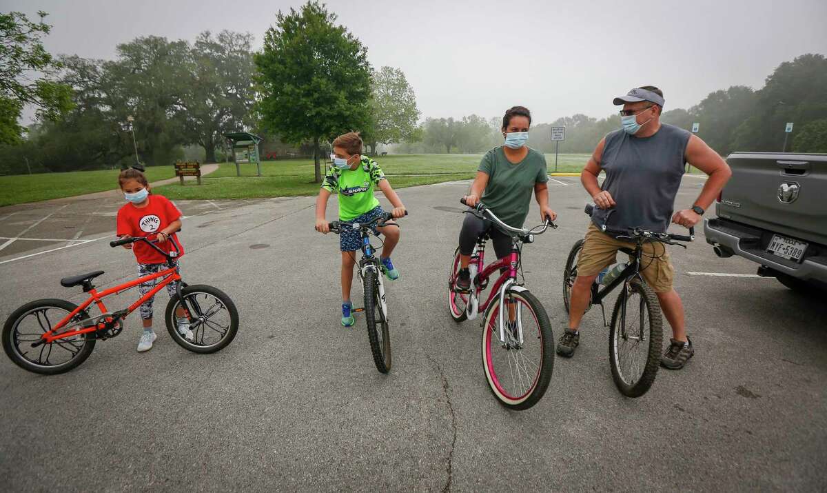 The Nemec family, Claira, 7, Ricky 11, Leidimar, mom and Ron dad, went for a bike ride in Brazos Bend State Park after Gov. Greg Abbott signed an executive order to open state parks Monday, April 20, 2020, in Needville. The Governor's executive order, park visitors will be required to wear face masks and maintain social distancing guidelines, with family groups no larger than five people.Anyone wishing to visit state parks need to fill out an online reservation prior to being admitted.