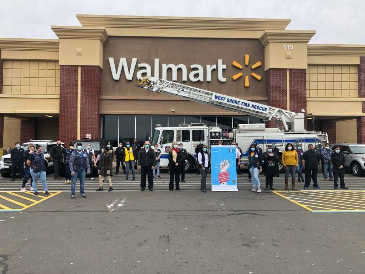 Walmart of West Haven employees donate several cases of Gatorade, water, and Lysol disinfectant spray and wipes to aid first responders in the coronavirus fight.