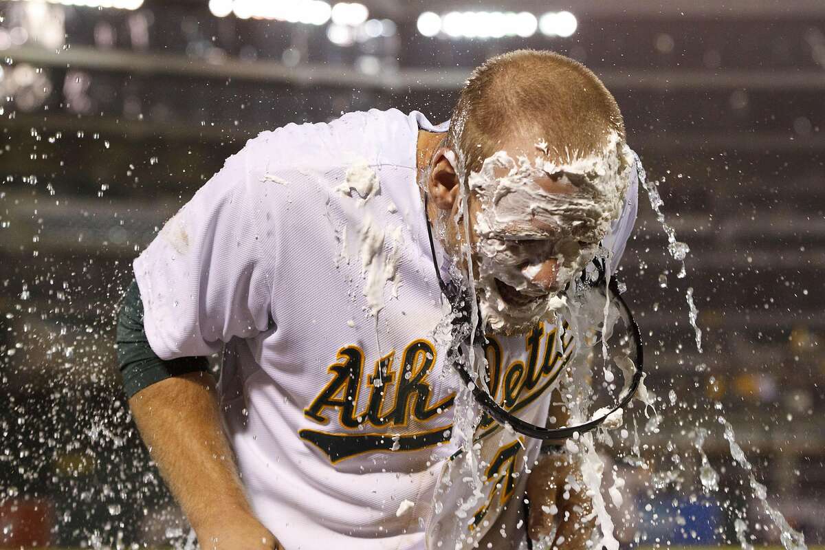 OAKLAND, CA - APRIL 30: Brandon Moss #37 of the Oakland Athletics reacts after getting hit with a pie and Gatorade after hitting a walk off two run home run against the Los Angeles Angels of Anaheim during the nineteenth inning at O.co Coliseum on April 30, 2013 in Oakland, California. The Oakland Athletics defeated the Los Angeles Angels of Anaheim 10-8 in 19 innings. (Photo by Jason O. Watson/Getty Images) *** BESTPIX ***