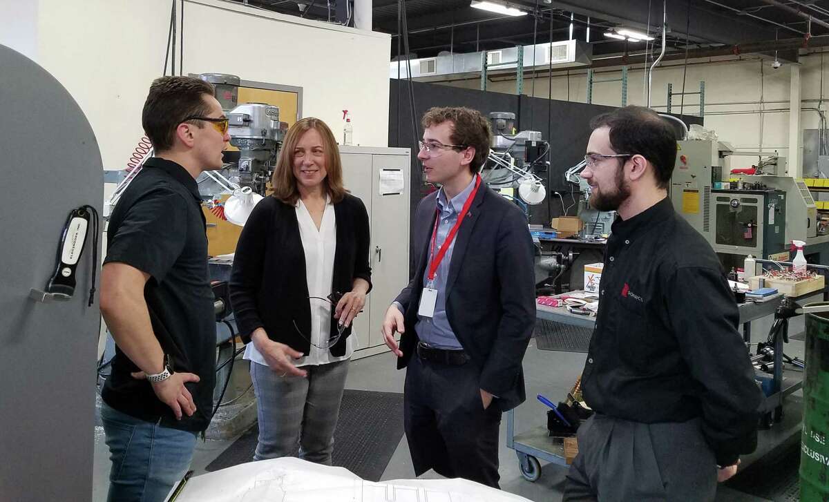 Westport State Sen. Will Haskell, third from left, visits with Sonics & Materials, Inc. employees recently.