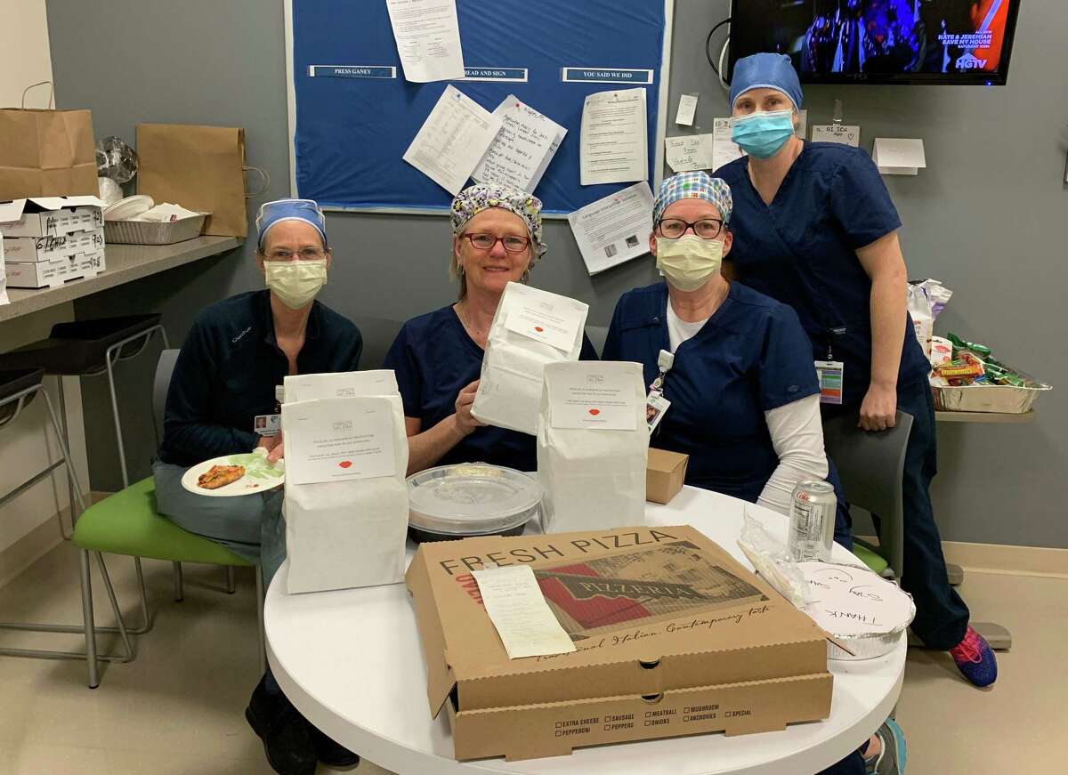 ICU and emergency room nurses and staff at Norwalk Hospital enjoy pizza donated by neighbors on Chestnut Hill Road in Wilton.