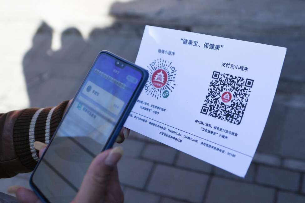 QR codes Residents in China are using QR codes to gain entry to businesses, such as restaurants; it's all part of a color-based health code system. Users sign up for the health code system and are required to enter personal information and answer a series of questions, such as previous travel, if you've had contact with a COVID-19 patient (suspected or diagnosed) and any symptoms you may be experiencing. You are then issued a red, amber or green color. Those with a red code will have to go into self-quarantine for 14 days; amber requires a quarantine period of seven days; green means you are allowed to move around the cities. Restaurants, based on the color of your health QR code, can either let you enter or turn diners away. To read more about the system, head to CNN. Shown: A resident who has returned to Beijing scans a QR code to register personal information at a neighborhood committee in Xiaojingchang Hutong in Dongcheng District of Beijing, capital of China, on March 10, 2020.