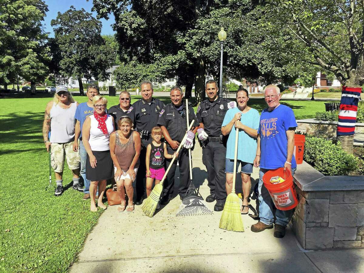 Volunteers and members of the Torrington Police Department lent a hand cleaning up Coe Memorial Park, where the city’s Earth Day celebration is traditionally held, in 2017. This year, the events are canceled, but residents can still do their own cleanup on Saturday.