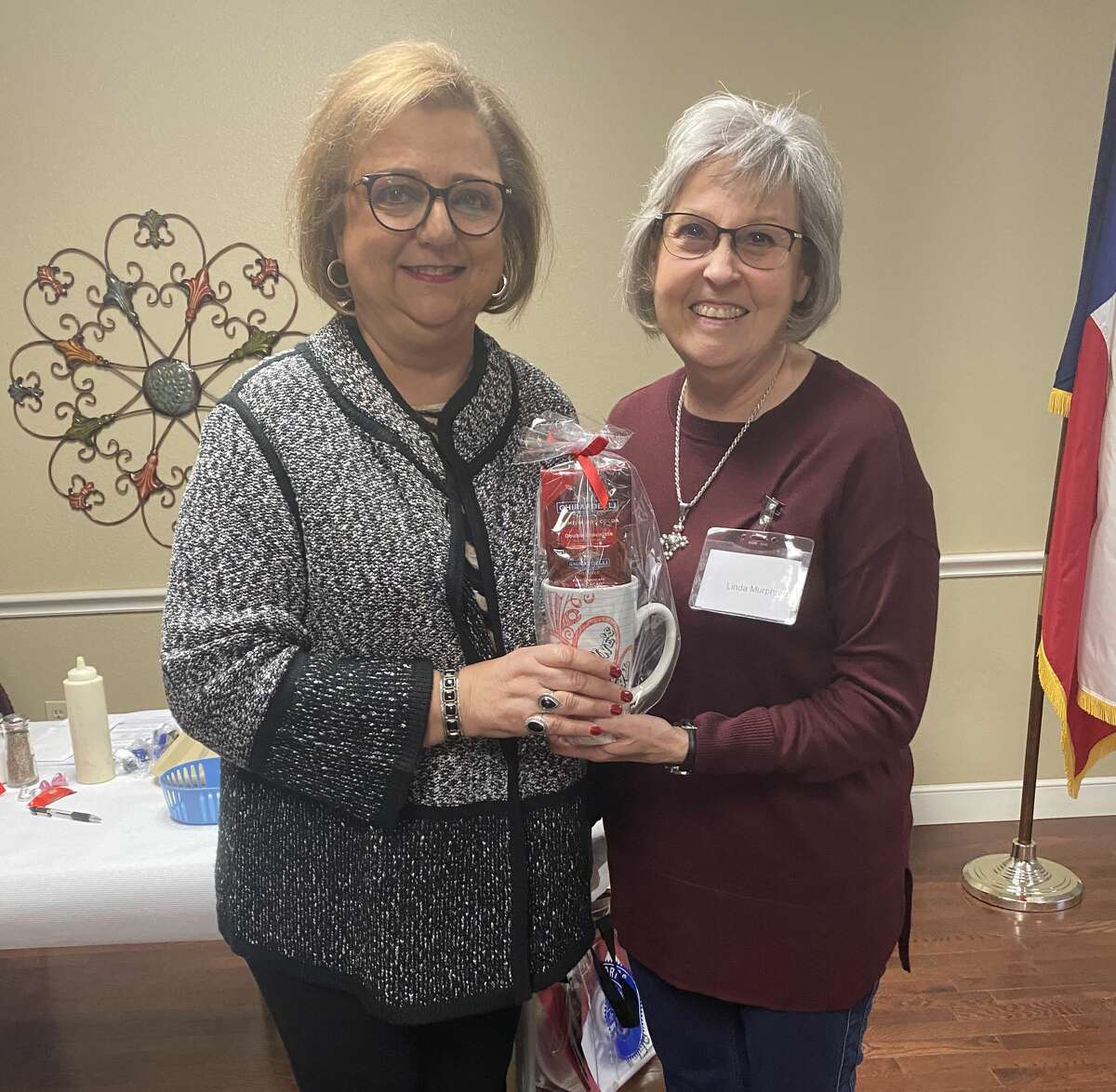 Irma Shackelford (RSVP) stands with Linda Murphree (Co-President of Plainview Area Retired School Personnel Association) for a photo after a recent PARSPA meeting.
