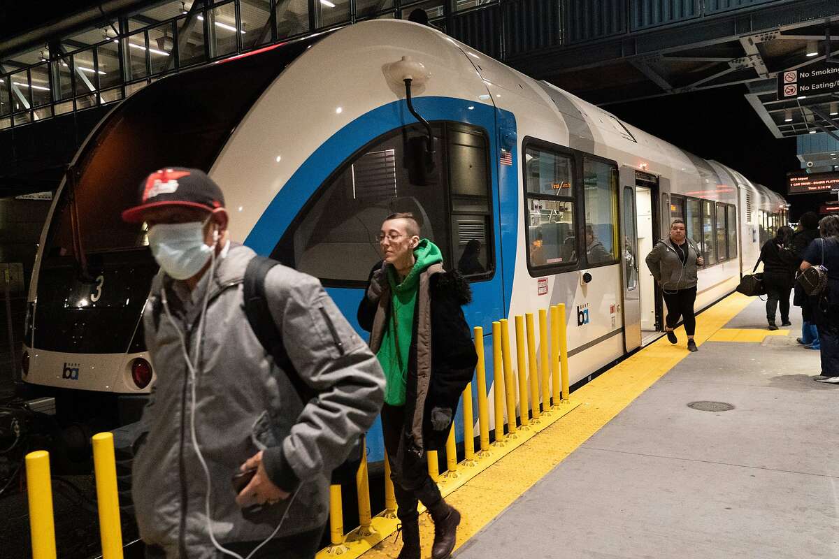 Passengers get off at the Antioch BART station on Thursday, March 12, 2020, in Antioch, Calif.