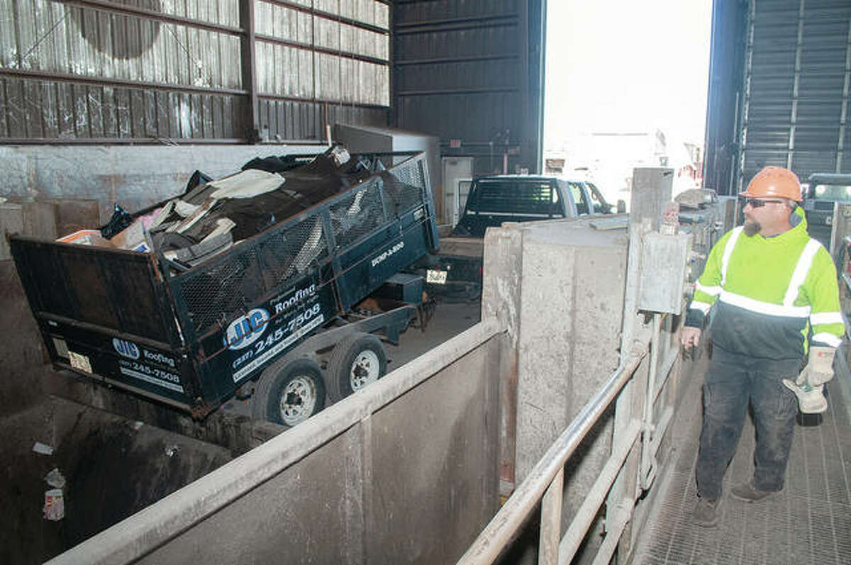 Area Disposal Service employee Dave Kessinger monitors the dumping of construction waste. The transfer station on Illinois Route 104 accepts residential and commercial trash, which is transferred on to semi-trailers and hauled to landfills. Operations manager Joey Buster said they haul about six semis a day, each averaging from 6 to 8 tons of garbage.